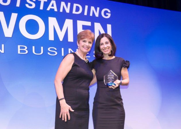EON Office CEO Elena Sirpolaidis receives her Outstanding Women in Business award from the Denver Business Journal.